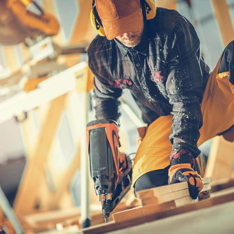 construction-worker-with-nail-gun-in-his-hand